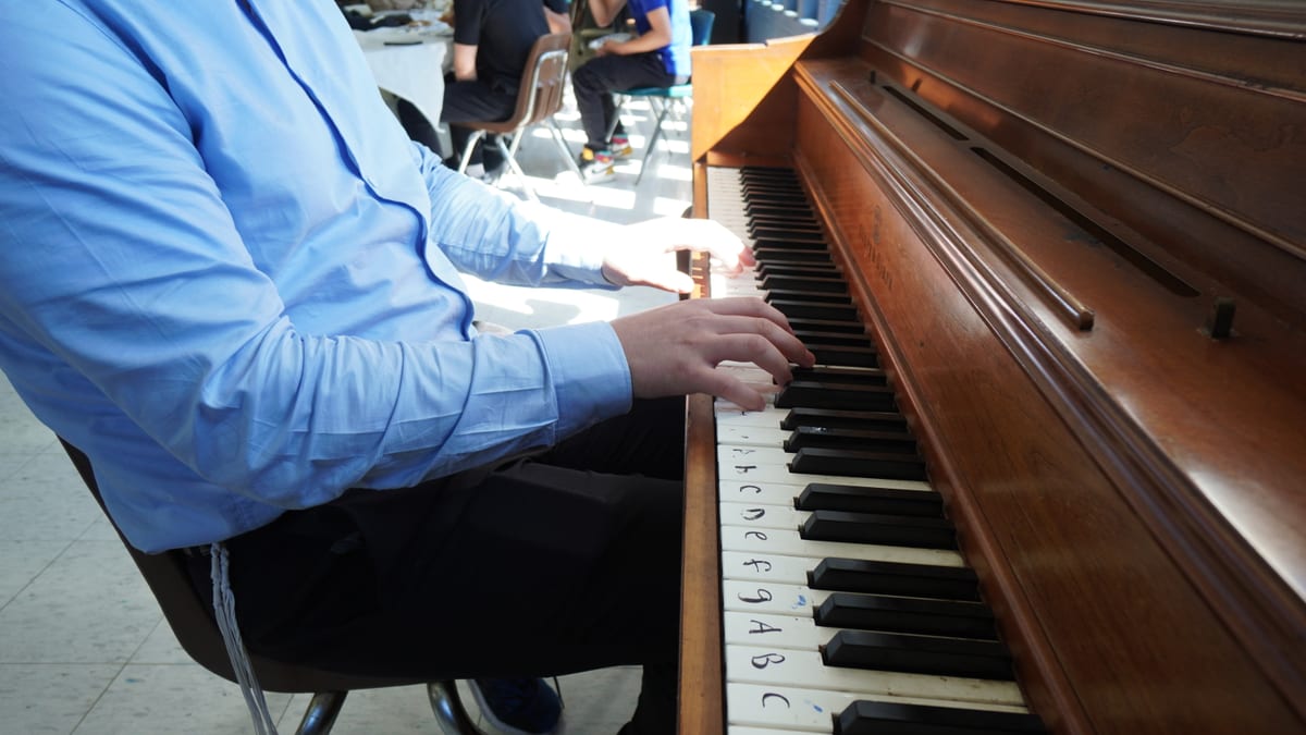 A WHHS student at the piano