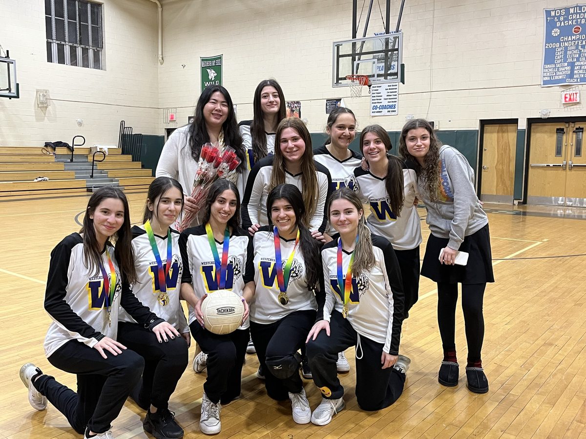The WHHS girls volleyball team with their medals