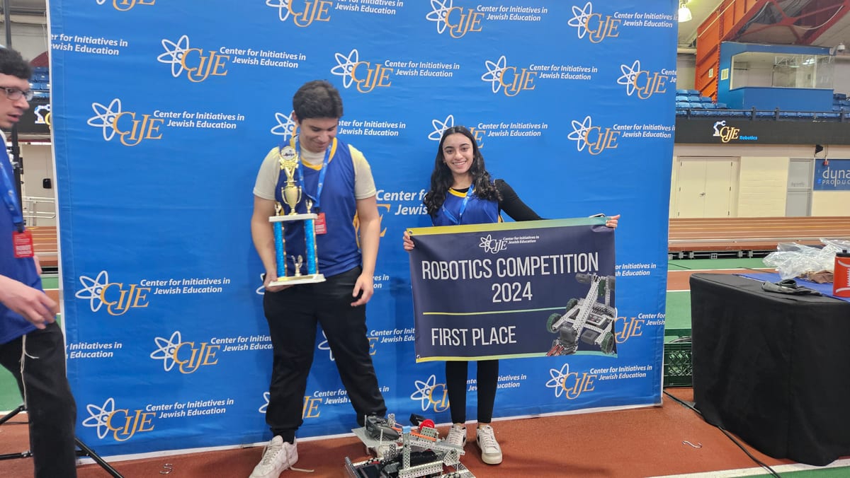 The WHHS robotics team with its first-place trophy